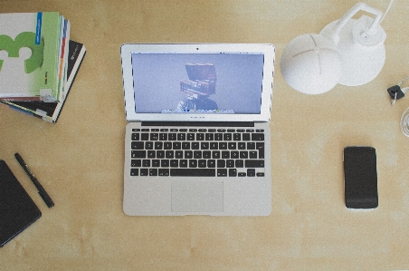 Laptop iphone desk notebook Photo