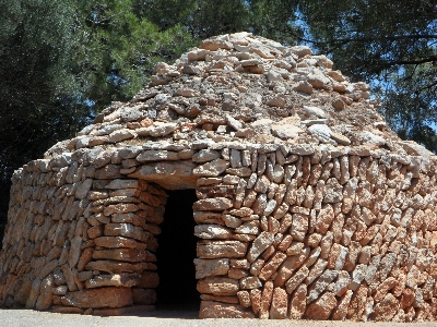 Rock wood trunk hut Photo