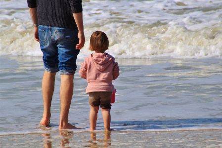 Foto Pria pantai laut pesisir