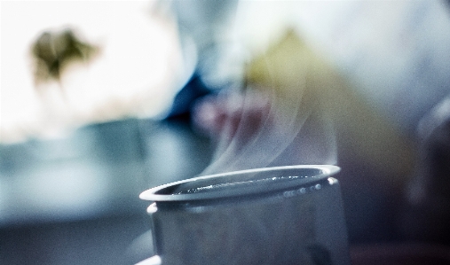 Writing hand coffee light Photo