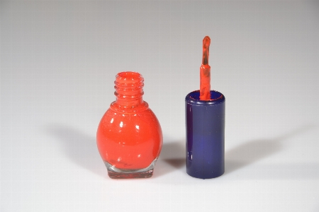 Red paint bottle glass Photo