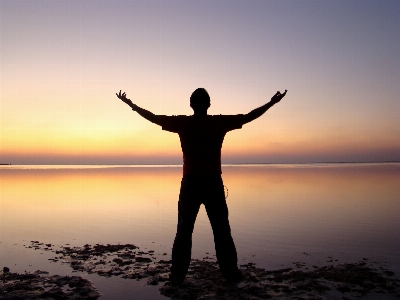 Hand man beach sea Photo