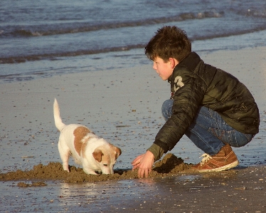 Foto Spiaggia mare giocare ragazzo