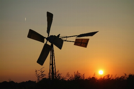 Silhouette sun sunset windmill Photo