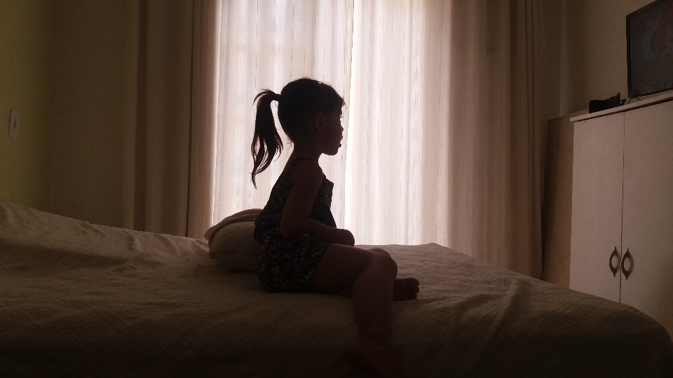 Silhouette light girl sitting