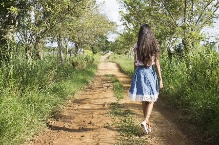 Forest grass walking girl Photo