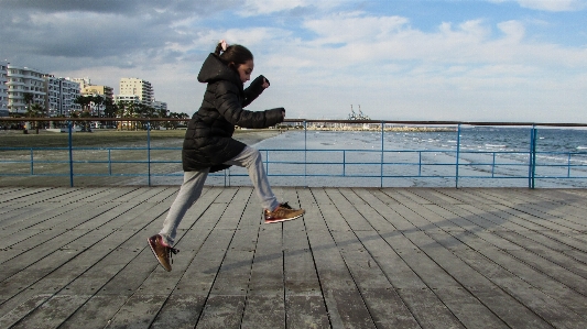 Sea deck boardwalk girl Photo