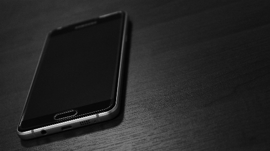 Smartphone screen table black and white Photo