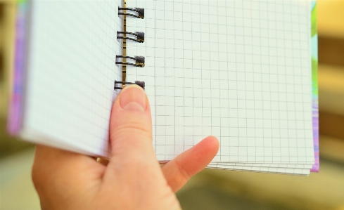 Writing hand notepad pattern Photo