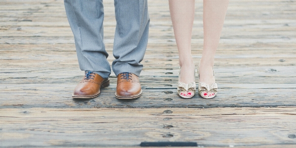 Hand man shoe boardwalk Photo