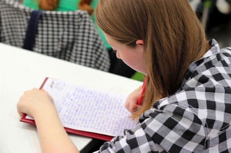 Writing person pen reading Photo