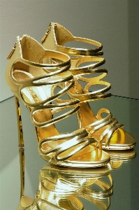 Shoe golden metal yellow Photo