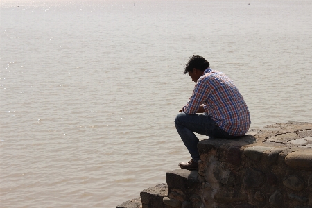 Man beach sea coast Photo