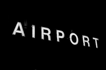 Black and white airport sign neon Photo