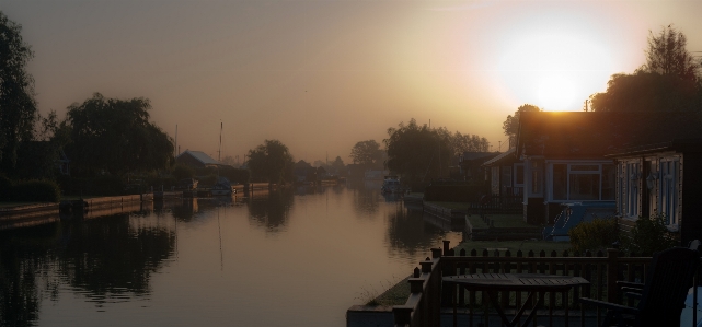 Landscape sunrise sunset boat Photo