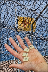 Hand person fence wire Photo