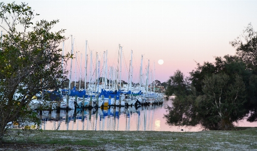 Sea water dock sunset Photo