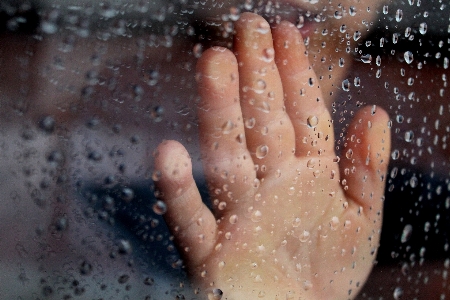 Hand window glass wet Photo