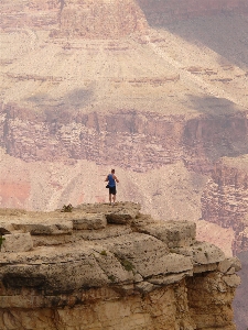 Rock person view valley Photo