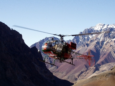 Mountain range vehicle helicopter Photo