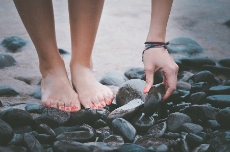 Foto Tangan pantai laut pasir