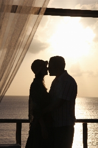 Man sunset love kiss Photo