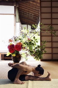 Man flower sitting exercise Photo