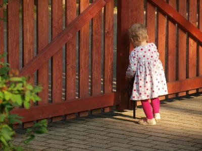 Fence girl summer red Photo