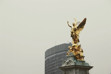 Monument statue golden office building Photo