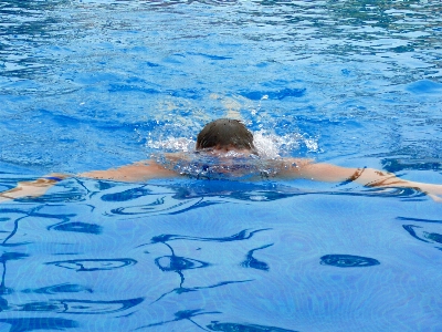 Swimming man water pool Photo