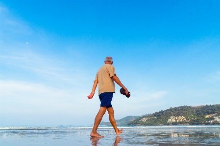 Man beach sea coast Photo