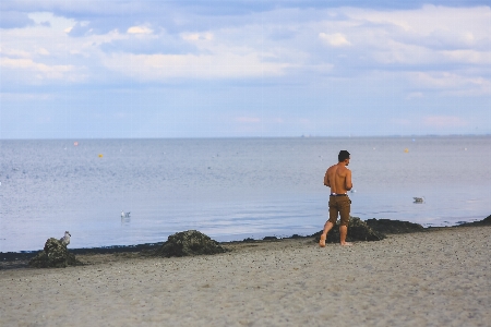 Man beach sea coast Photo