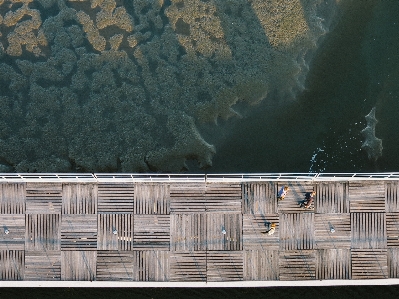 Sea water people boardwalk Photo