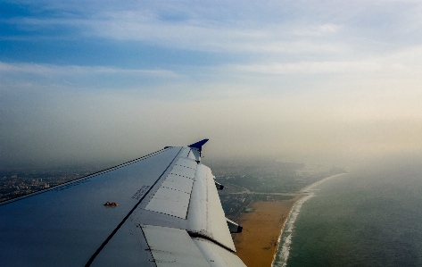 Foto Pantai laut cakrawala sayap