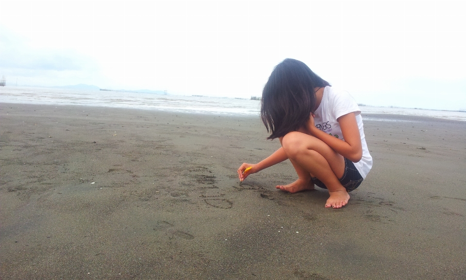 Writing hand beach landscape