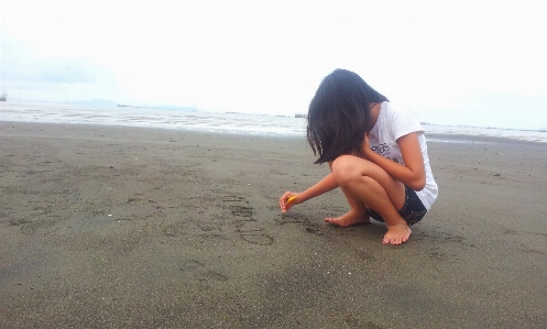 Writing hand beach landscape Photo