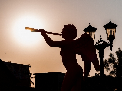 Silhouette sky sunset statue Photo