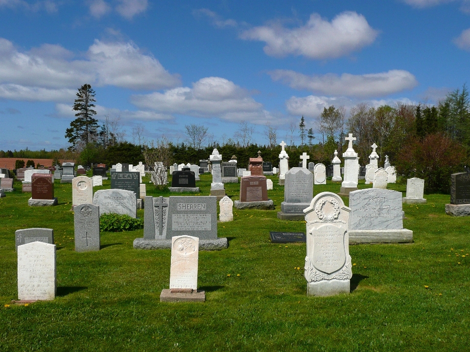 Stone cross cemetery tombstone