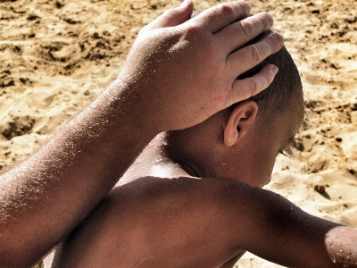 Hand man beach sand Photo