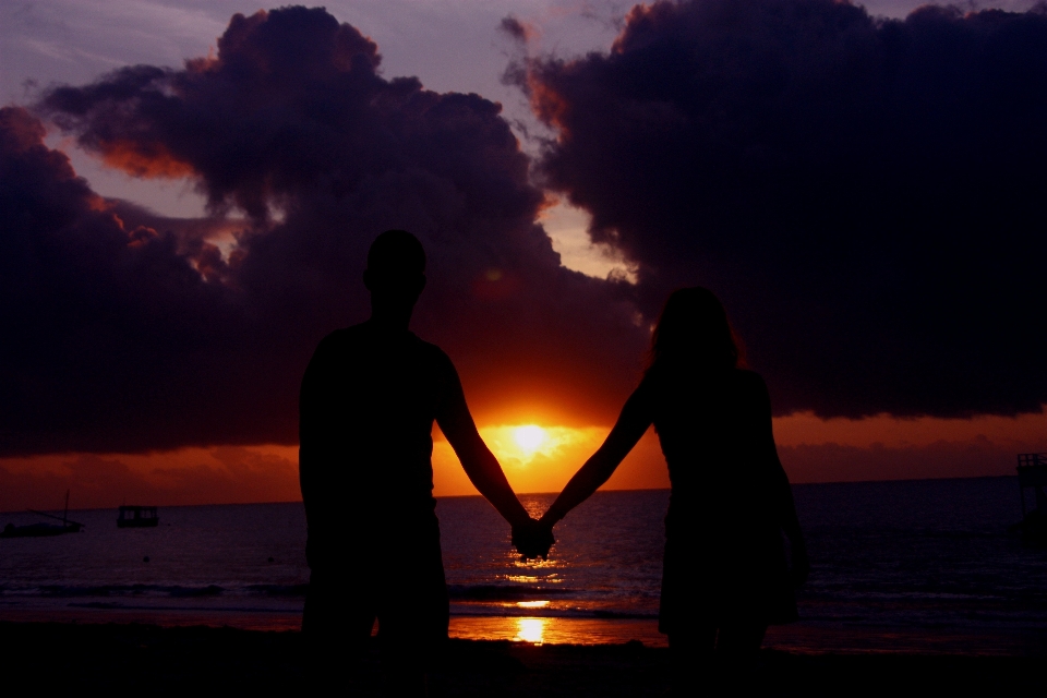 Beach ocean silhouette sun