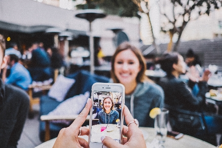 Iphone smartphone table person Photo