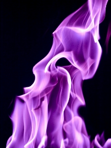 Glowing purple smoke flame Photo