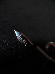 Darkness black fountain pen close up Photo