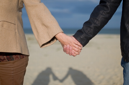 Hand beach sea people Photo