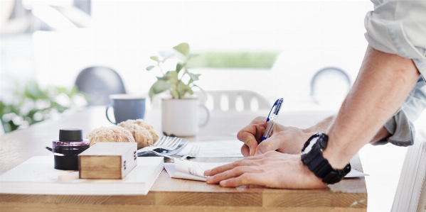 Writing hand man table Photo