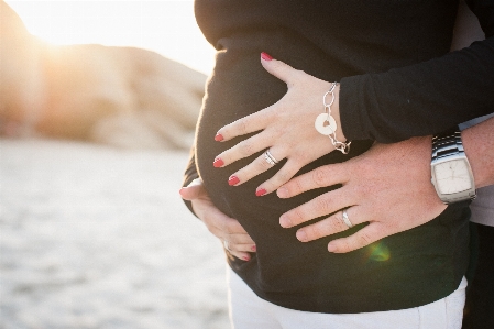 Hand beach girl sunset Photo