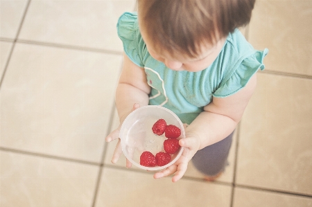 Hand girl play fruit Photo