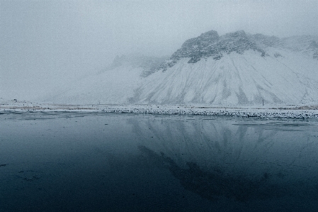 Foto Mar montaña nieve invierno