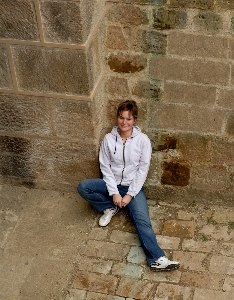 Man girl wall sitting Photo