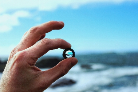 Foto Mão céu dedo azul